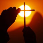 A demonstrator holds pencils in tribute to the victims of a shooting by gunmen at the offices of French satirical weekly Charlie Hebdo during a demonstration in Niteroi