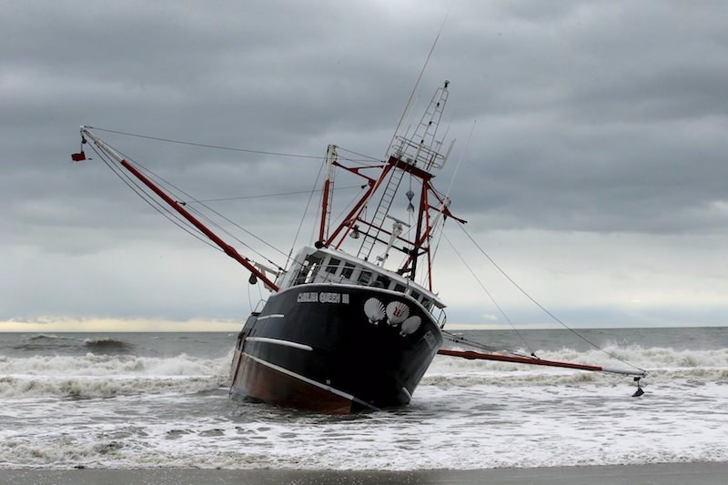 The boat Carolina Queen III is seen at Rockaway, New York February 25, 2016. High seas and strong winds stranded the 76-foot commercial fishing vessel off New York's Rockaway Beach and capsized a U.S. Coast Guard boat that rushed to help on Thursday, but no one was injured, a Coast Guard spokeswoman said. REUTERS/Eduardo Munoz