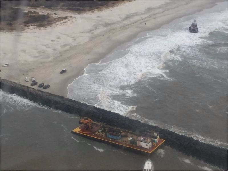 The 77-foot tugboat Miss Katie and the 135-foot barge it was towing ran aground near the Absecon Inlet Saturday, Feb. 20, 2016. The tugboat lost power and its towlines fouled in the propellers causing the two vessels to drift and ground.