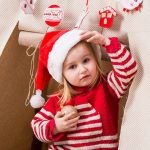 bigstock-cute-little-girl-in-red-santa-149120702