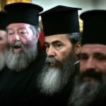 ΙΕΡΟΥΣΑΛΗΜ – ΕΚΛΟΓΗ ΤΟΥ ΑΡΧΙΕΠΙΣΚΟΠΟΥ ΘΑΒΩΡΙΟΥ, ΘΕΟΦΙΛΟΥ ΣΤΗΝ ΘΕΣΗ ΤΟΥ ΠΑΤΡΙΑΡΧΗ ΙΕΡΟΣΟΛΥΜΩΝ. ΣΤΗ ΦΩΤΟ ΔΕΥΤΕΡΟΣ ΔΕΞΙΑ Ο ΝΕΟΣ ΠΑΤΡΙΑΡΧΗΣ ΙΕΡΟΣΟΛΥΜΩΝ, ΘΕΟΦΙΛΟΣ. Greek Orthodox Metropolitan Theofilos, second from right, is flanked by senior Greek Orthodox clergy during the synod for the election of the new Greek Patriarch of the Holy Land, in the Greek Orthodox Patriarchate in Jerusalem, Monday, Aug. 22, 2005. Metropolitan Theofilos was chosen as the new Patriarch of the Holy Land by church rebels who ousted his predecessor, Irineos, amid allegations he was involved in unsanctioned property transactions. (AP Photo/Lefteris Pitarakis)
